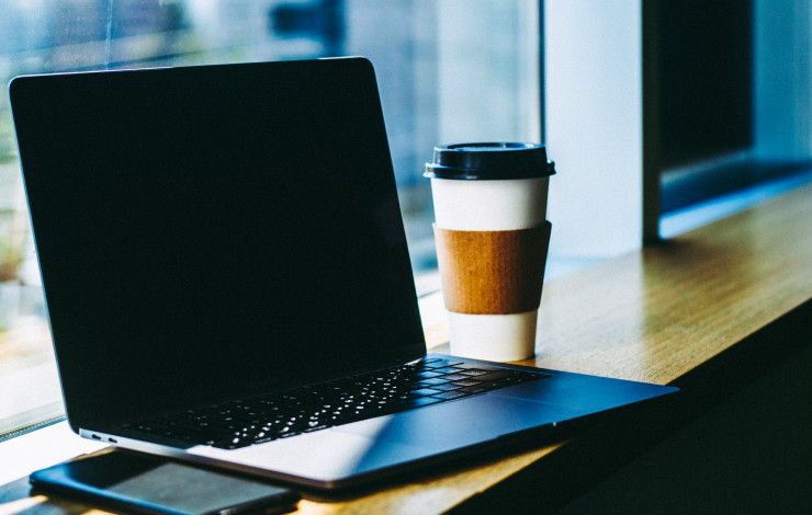 laptop with coffee cup