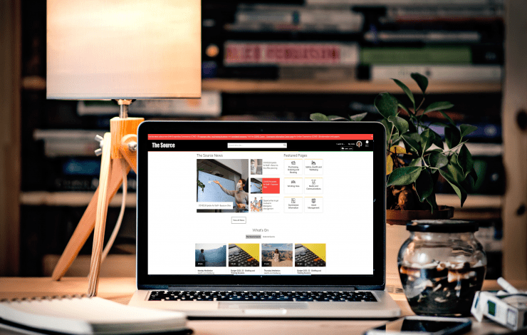 The Source Homepage showing on a laptop