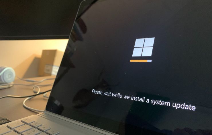 laptop with windows update screen showing
