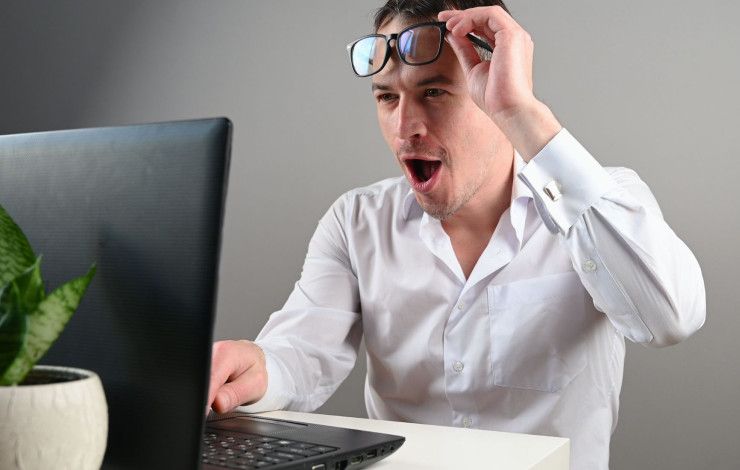 a person looking at a computer screen