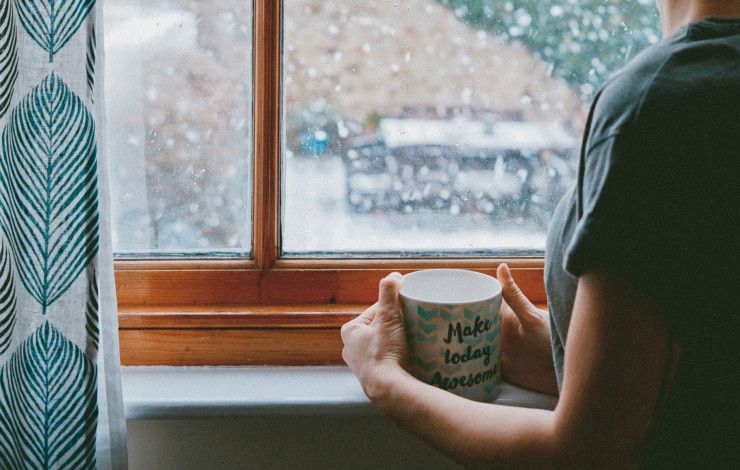 Person holding mug saying make today awesome