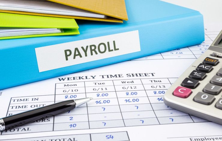 Folder labelled payroll and a time sheet