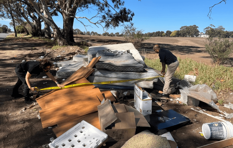 Sanjay and Caroline with dumped waste