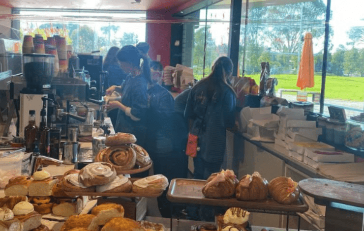 Staff serving at new cafe Lucky Lulu at Springvale Library
