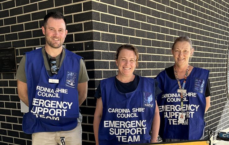 Staff with Emergency Relief sign