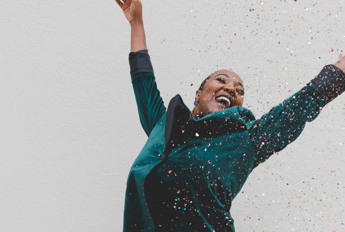woman celebrating with confetti