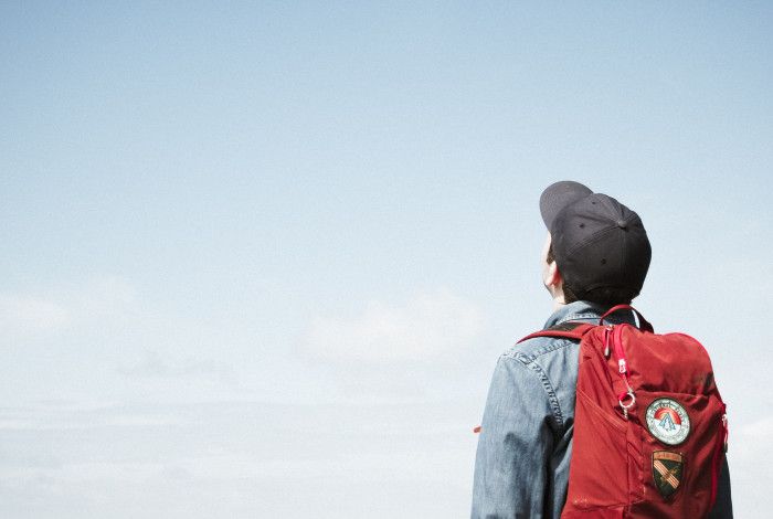young person with backpack on