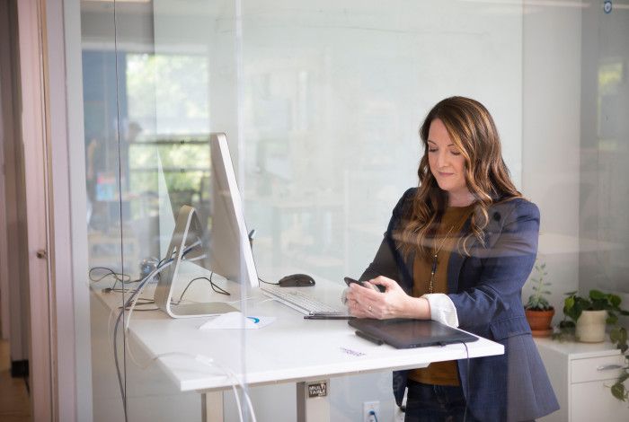 employee at standing desk