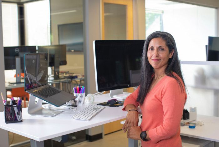 staff member standing at a standing desk
