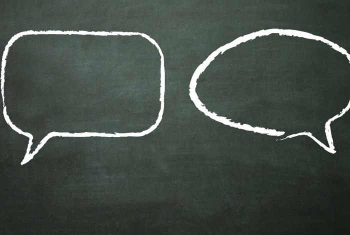 Two speech bubbles on a blackboard