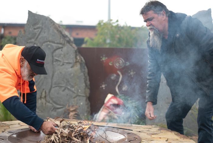 two men and smoking ceremony