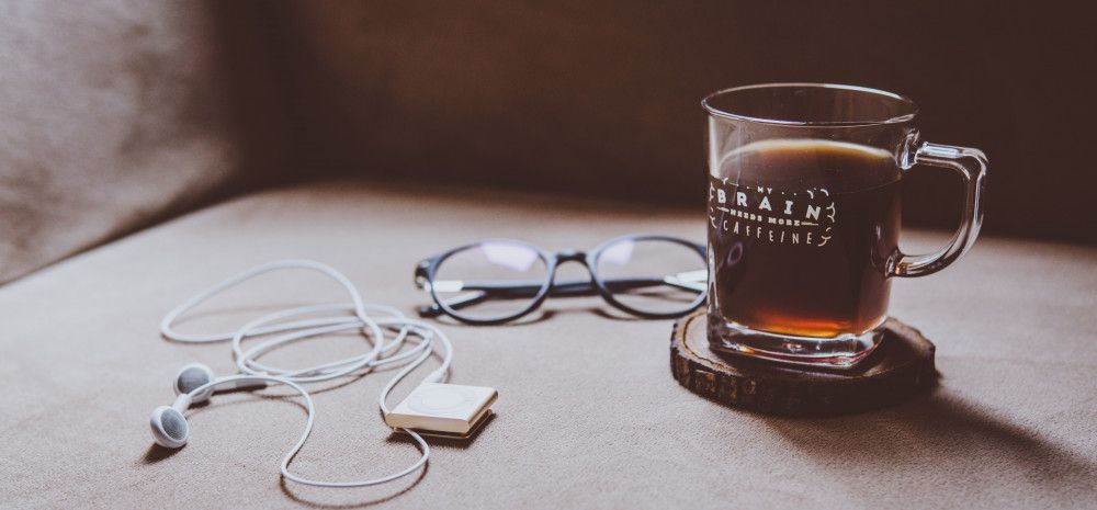 coffee, glasses and headphones