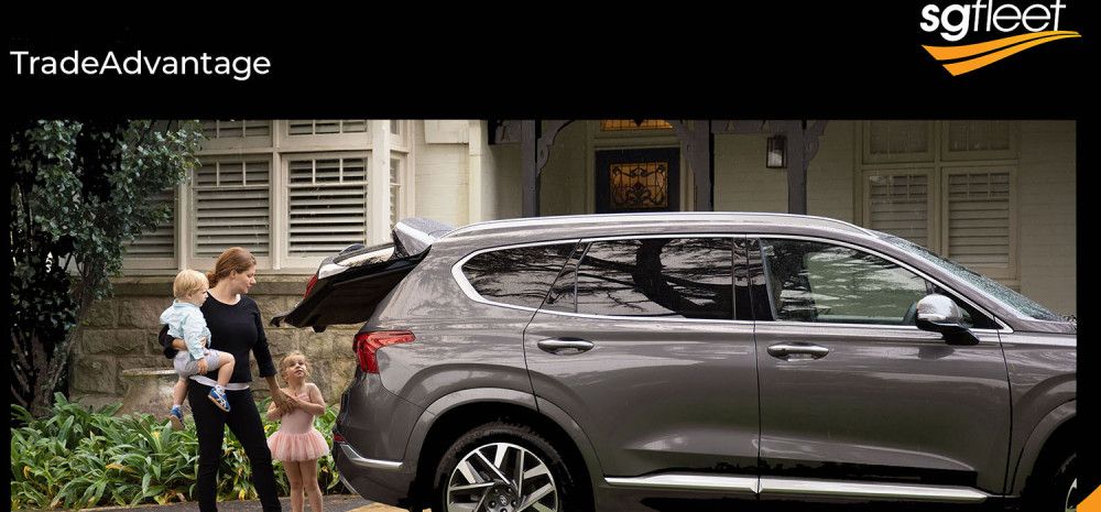 A lady holding children with her car
