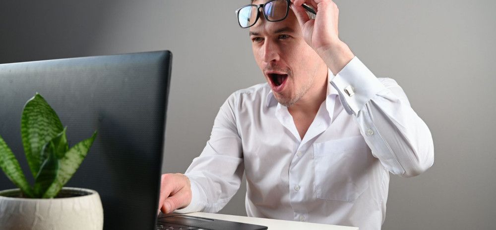 a person looking at a computer screen