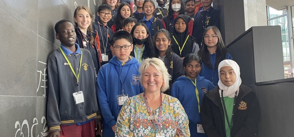 Kate and students standing on stairs