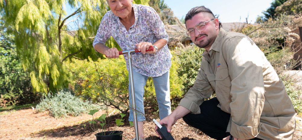 two people in a garden