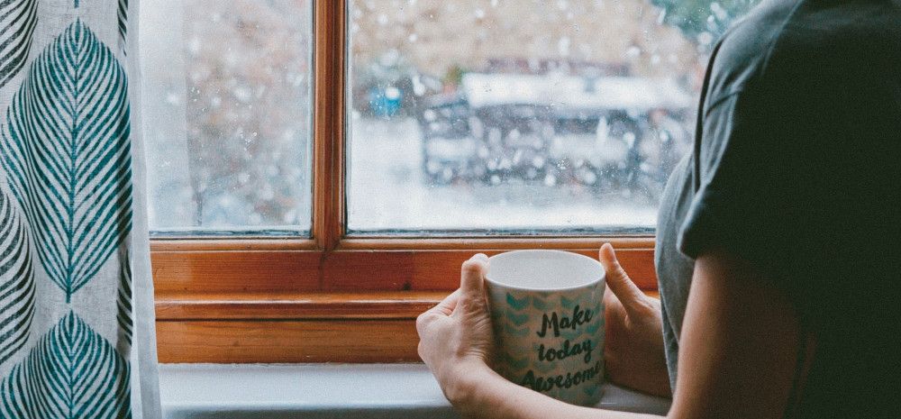 Person holding mug saying make today awesome