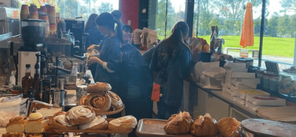 Staff serving at new cafe Lucky Lulu at Springvale Library