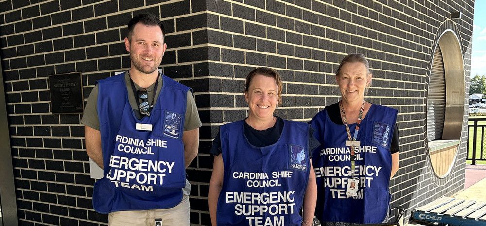 Staff with Emergency Relief sign