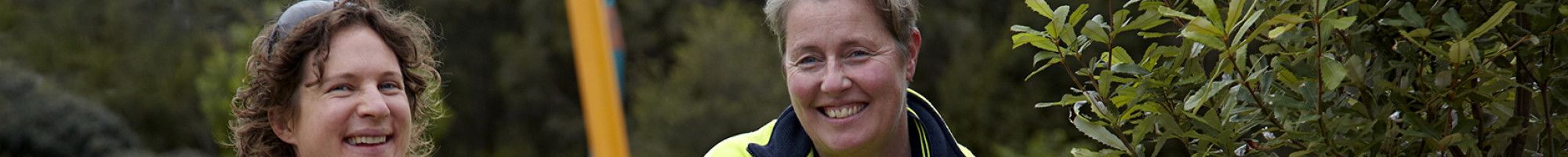 Two happy outdoor staff