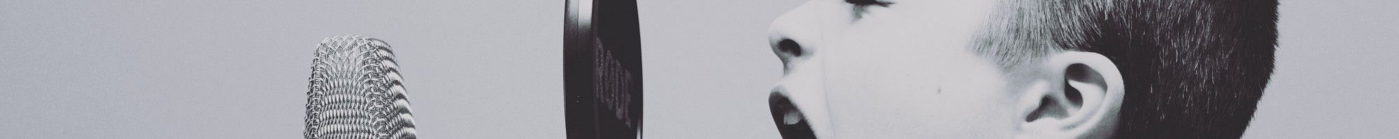 boy yelling into a microphone