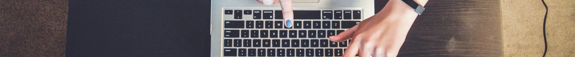 group pointing to a laptop