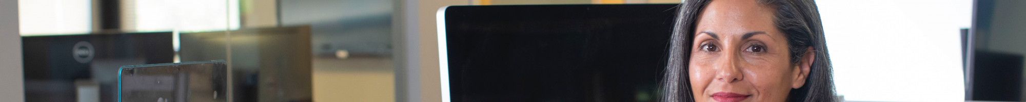 staff member standing at a standing desk