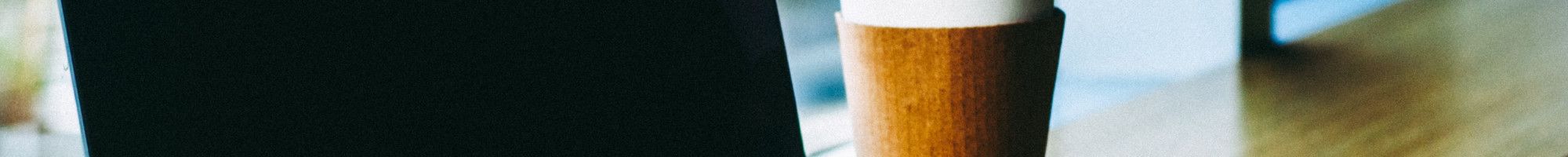 laptop with coffee cup