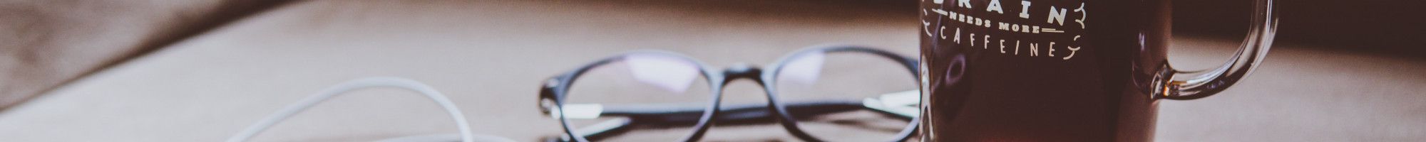 coffee, glasses and headphones