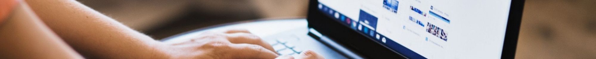 a person typing on a laptop