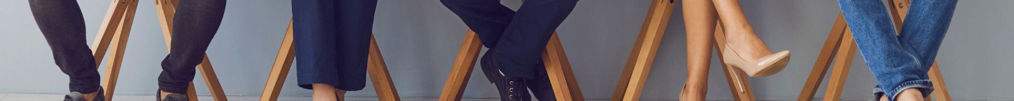 people sitting in a row on chairs