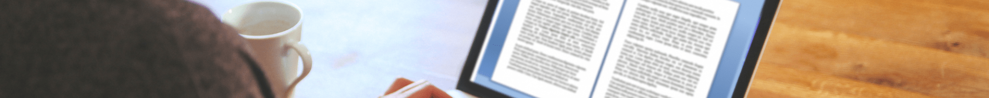 a person writing on a laptop