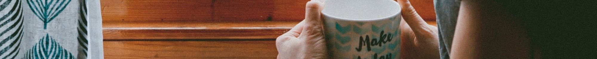 Person holding mug saying make today awesome