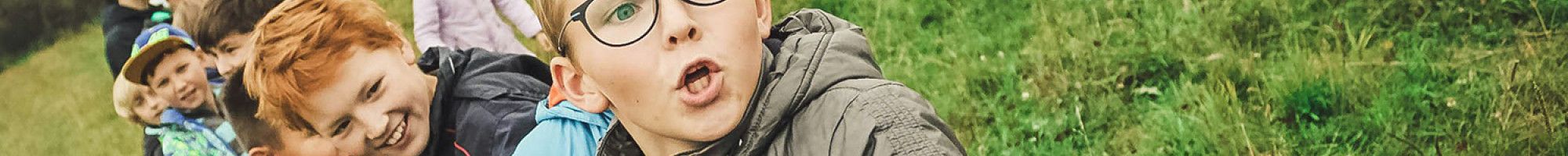 Children playing tug with robe