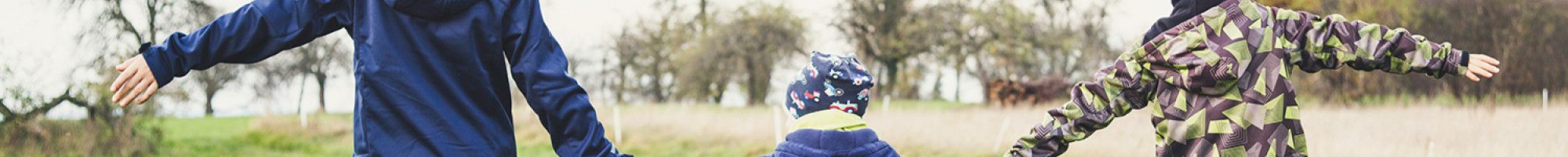 Three children playing outside