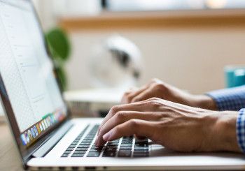 Person typing on laptop