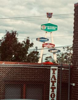 Andrea Wintrip - patterns - the familiarity and peculiarity of urban shapes against trees and clouds. Brick pattern, fence pattern, fluffy clouds, leaves, hexagons, trapezoids, triangles, parallel straight lines, diamonds, rectangles