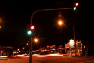 Mary Orsino - Something red - Red traffic lights and a light trail of vehicles tail lights moving through the intersection. I thought I'd try walking at a different time to get different type of images and try different settings, so this this the photo I liked best. 
