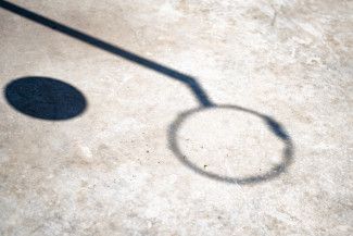 Mary Orsino - Shadow - throwing a ball through a hoop
