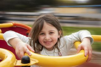 Mary Orsino - joy - my daughter on a spinning ride at the park having a fun time. She loves to get all dizzy.