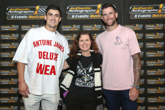 Robyn (centre) with two Collingwood Magpies