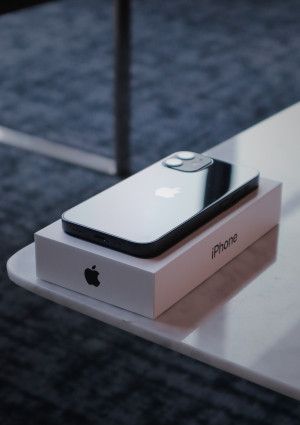 Iphone and box on table
