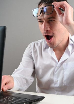 a person looking at a computer screen