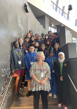 Kate and students standing on stairs