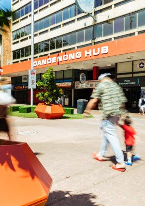 people walking through palm plaza