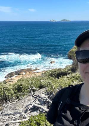 a person on a cliff smiling